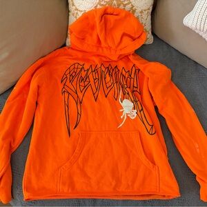 Revenge Clothing Orange Hoodie with Black and White Accents